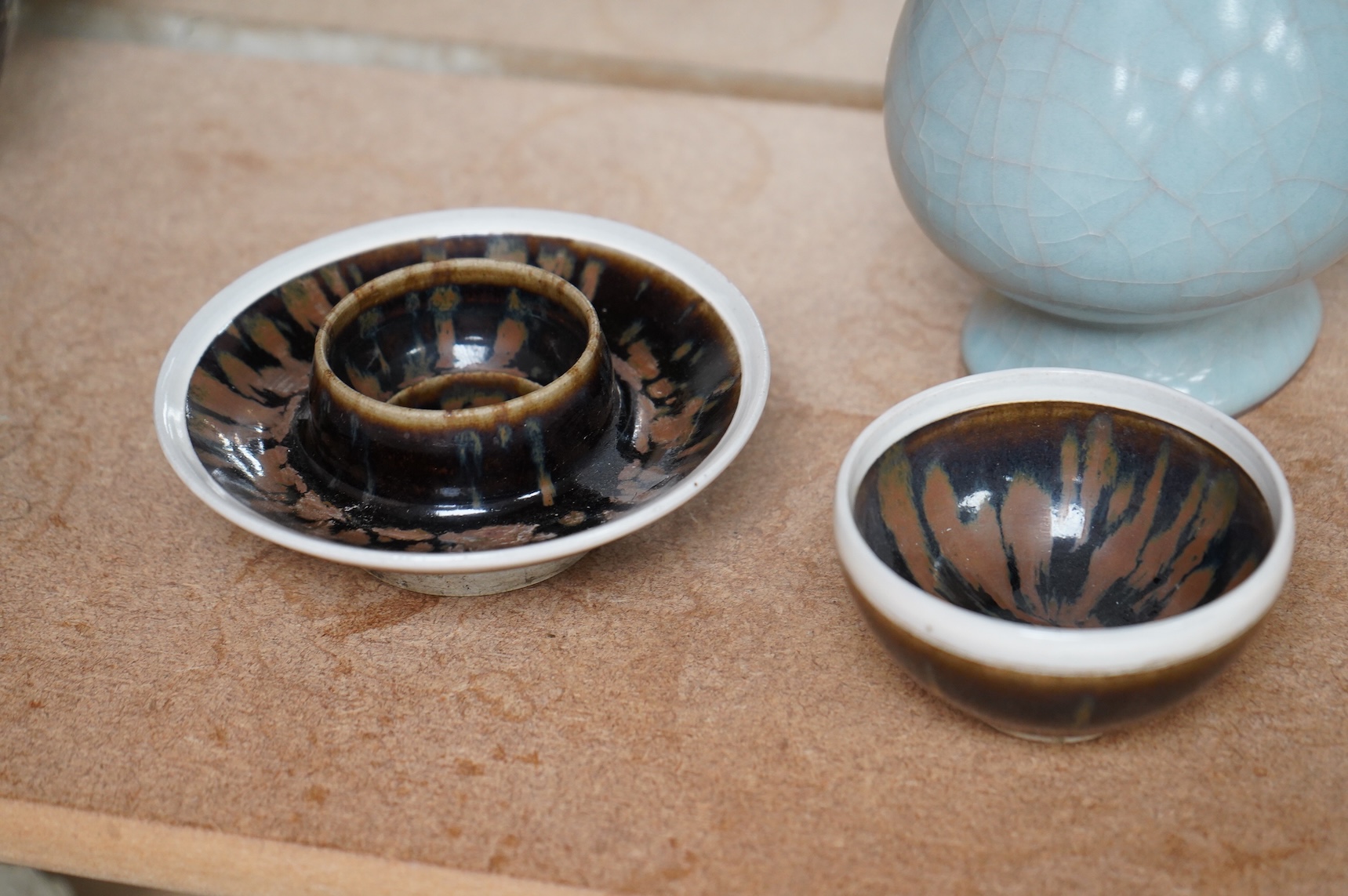 A Chinese crackle glaze arrow vase and a black and russet glazed tea bowl on stand, largest 22cm high